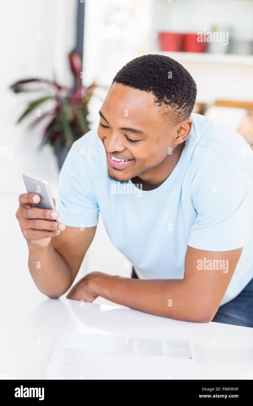 Happy man text messaging on mobile phone Stock Photo - Alamy