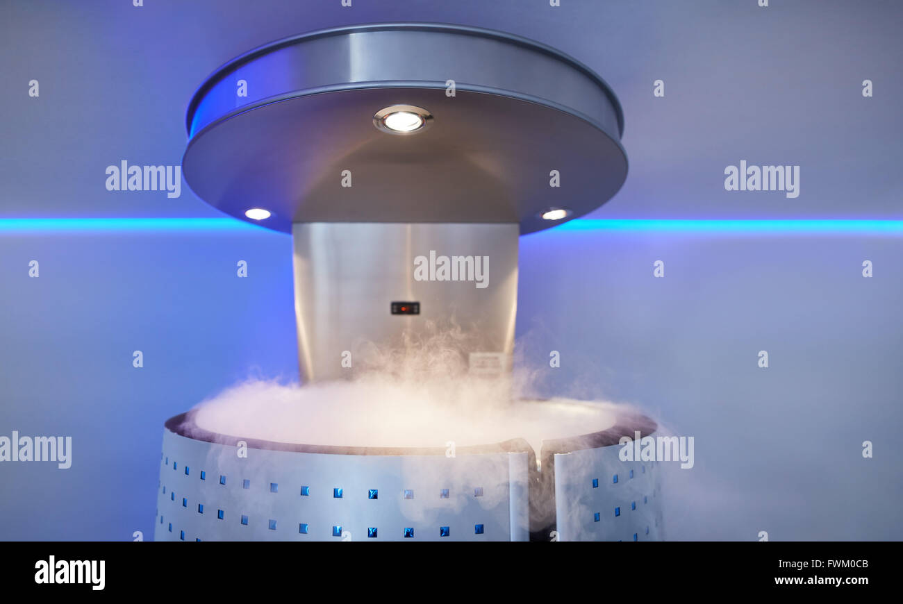 Cryotherapy capsule with cold nitrogen vapors in cosmetology clinic. Cryo sauna for whole body cryotherapy treatment. Stock Photo