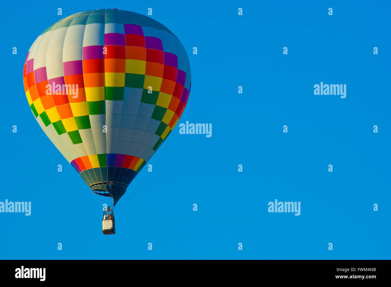 Hot Air balloon against a blue sky Stock Photo - Alamy