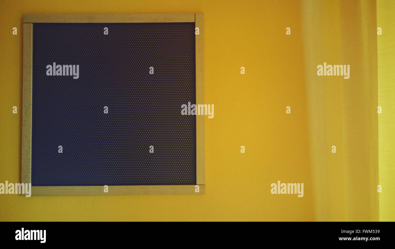 Metal Window On Yellow Wall Stock Photo Alamy