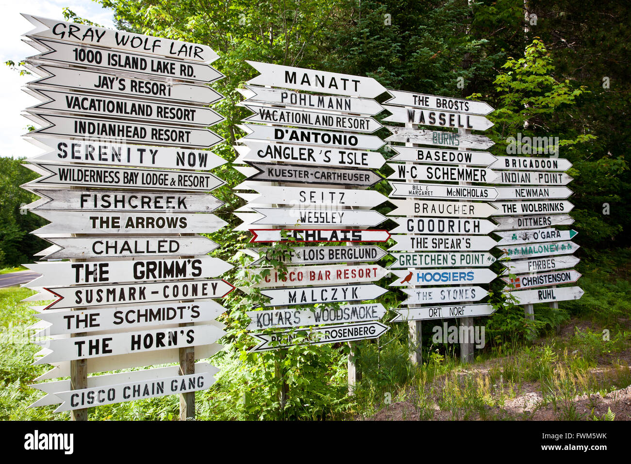 Wooden handmade signs in the forest of the Northwoods on Land O'Lakes, Wisconsin Stock Photo