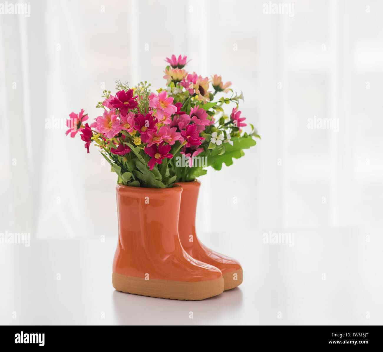 decorations for the garden. boots with flowers Stock Photo