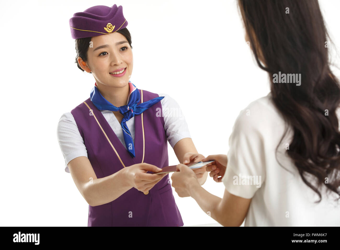 Young female flight attendants for customers to pass a passport Stock Photo