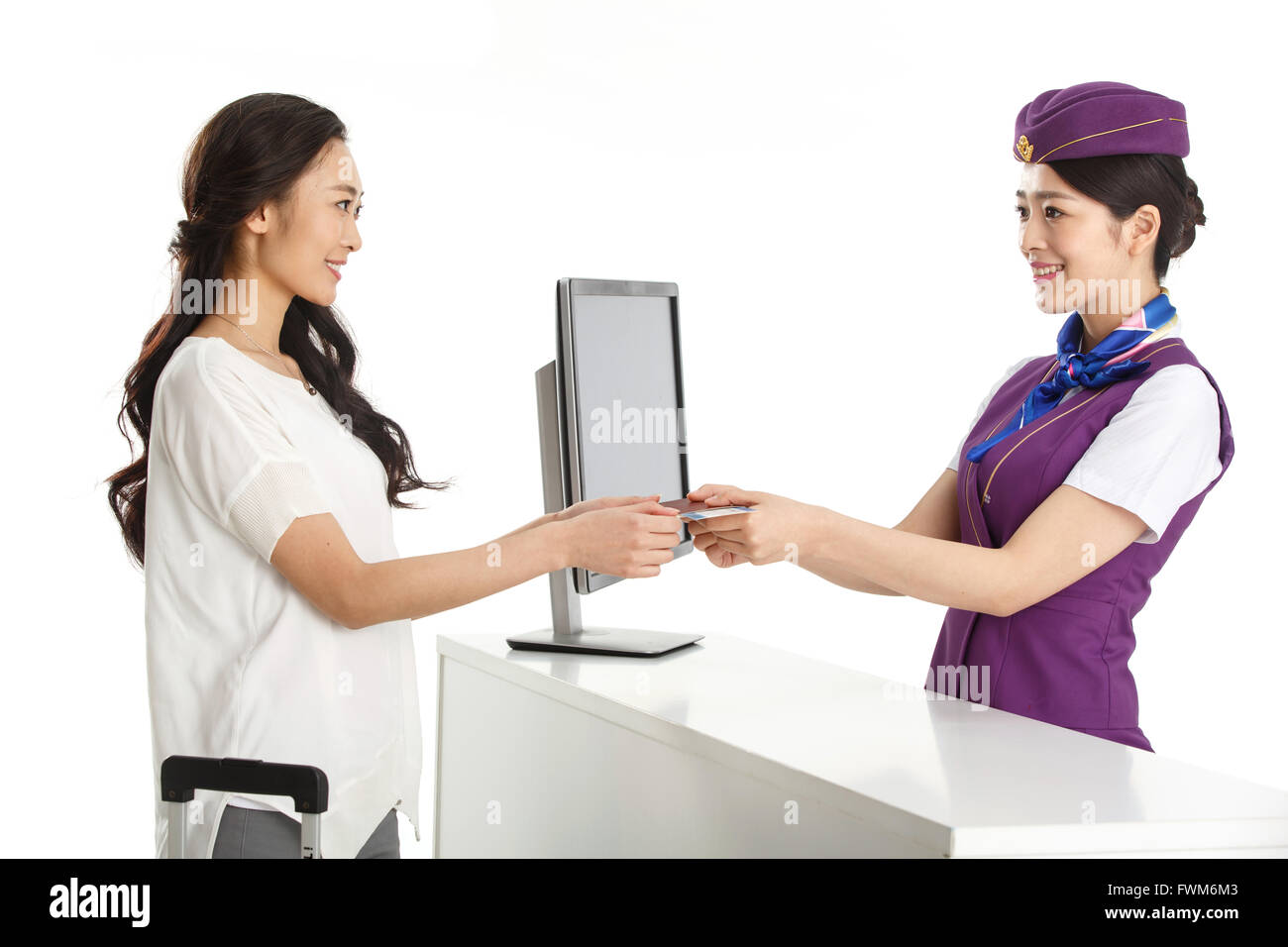 Young female flight attendants for customers to pass a passport Stock Photo