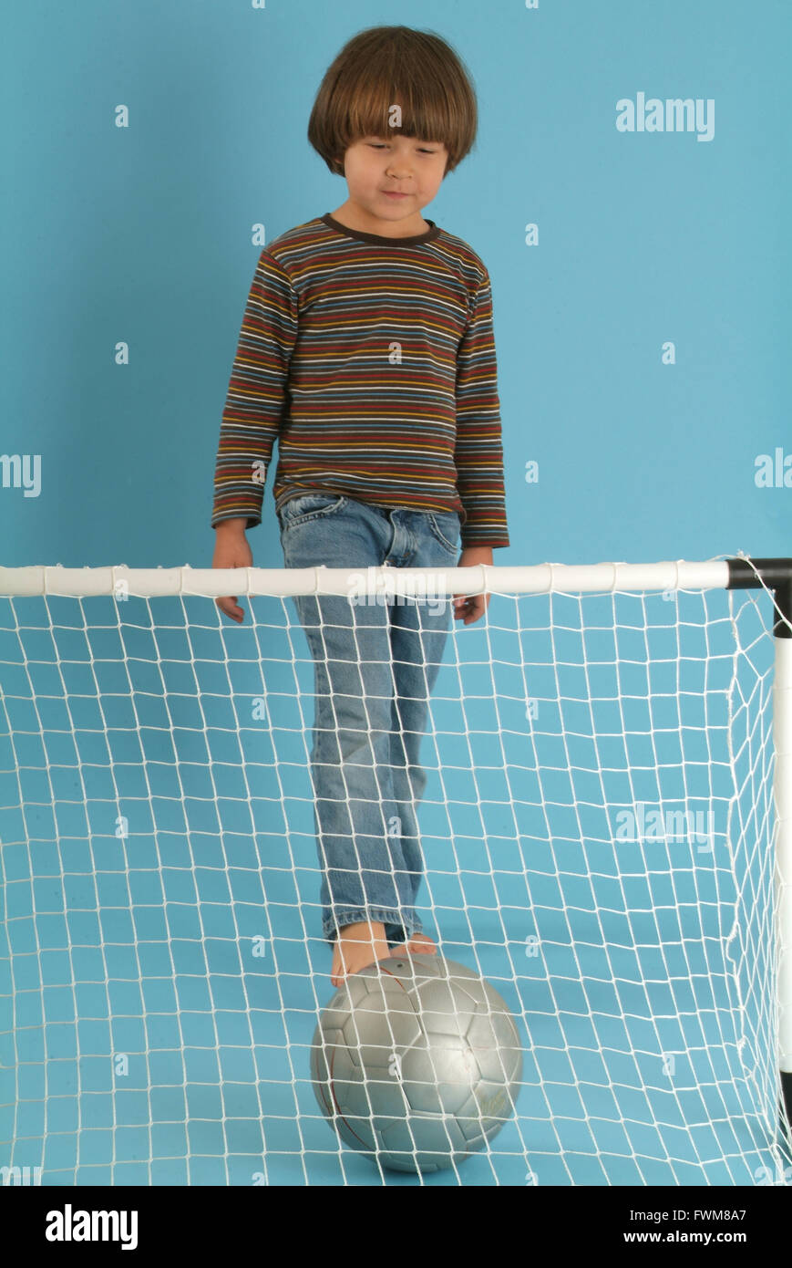 Boy playing with a ball Stock Photo - Alamy