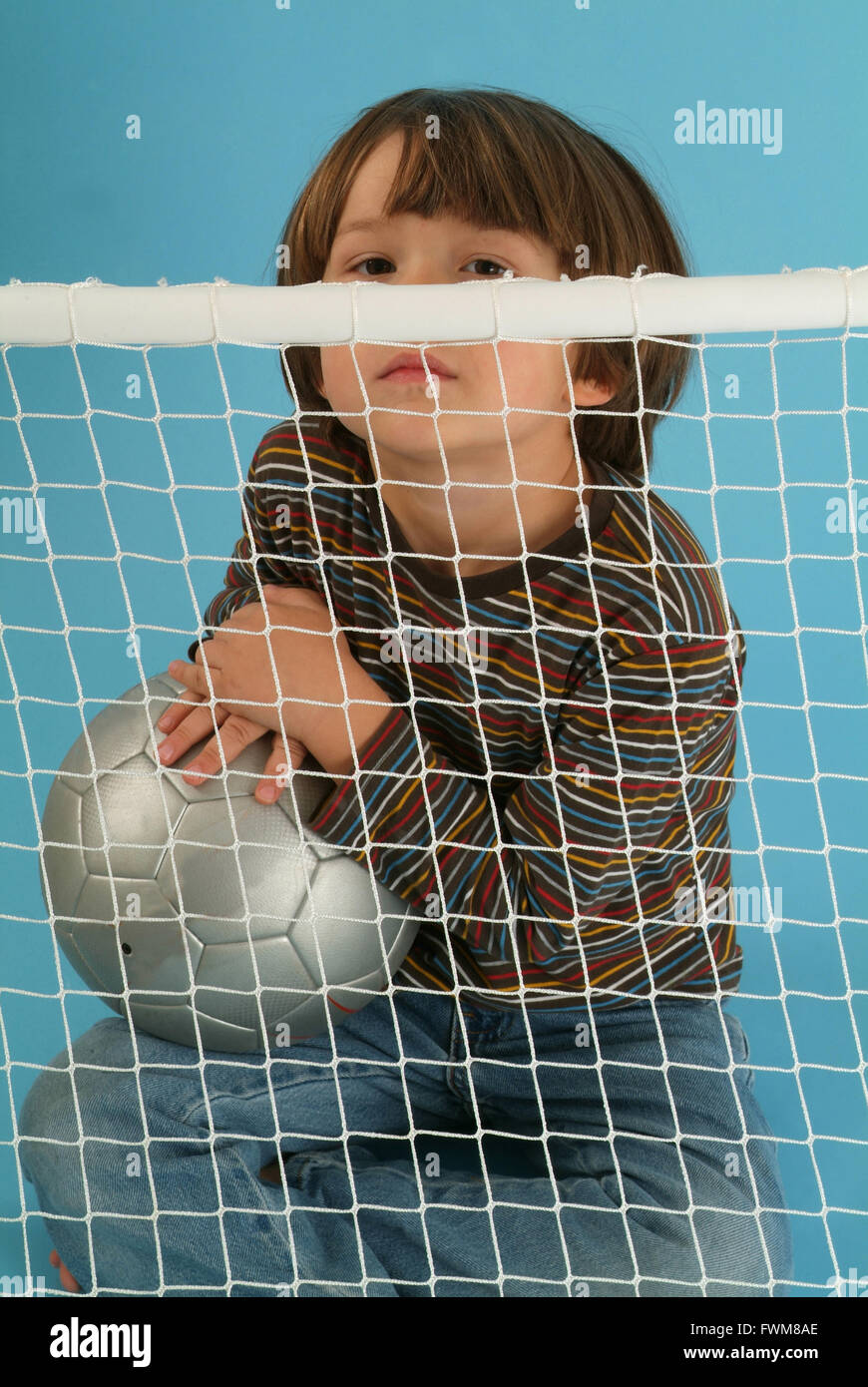 Boy playing with a ball Stock Photo - Alamy