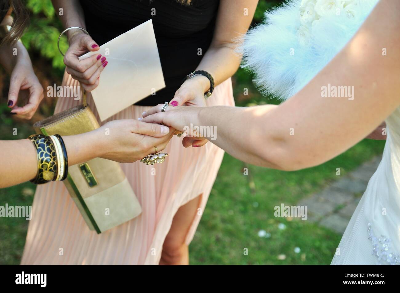 Friends Admiring Bride Wedding Ring Stock Photo