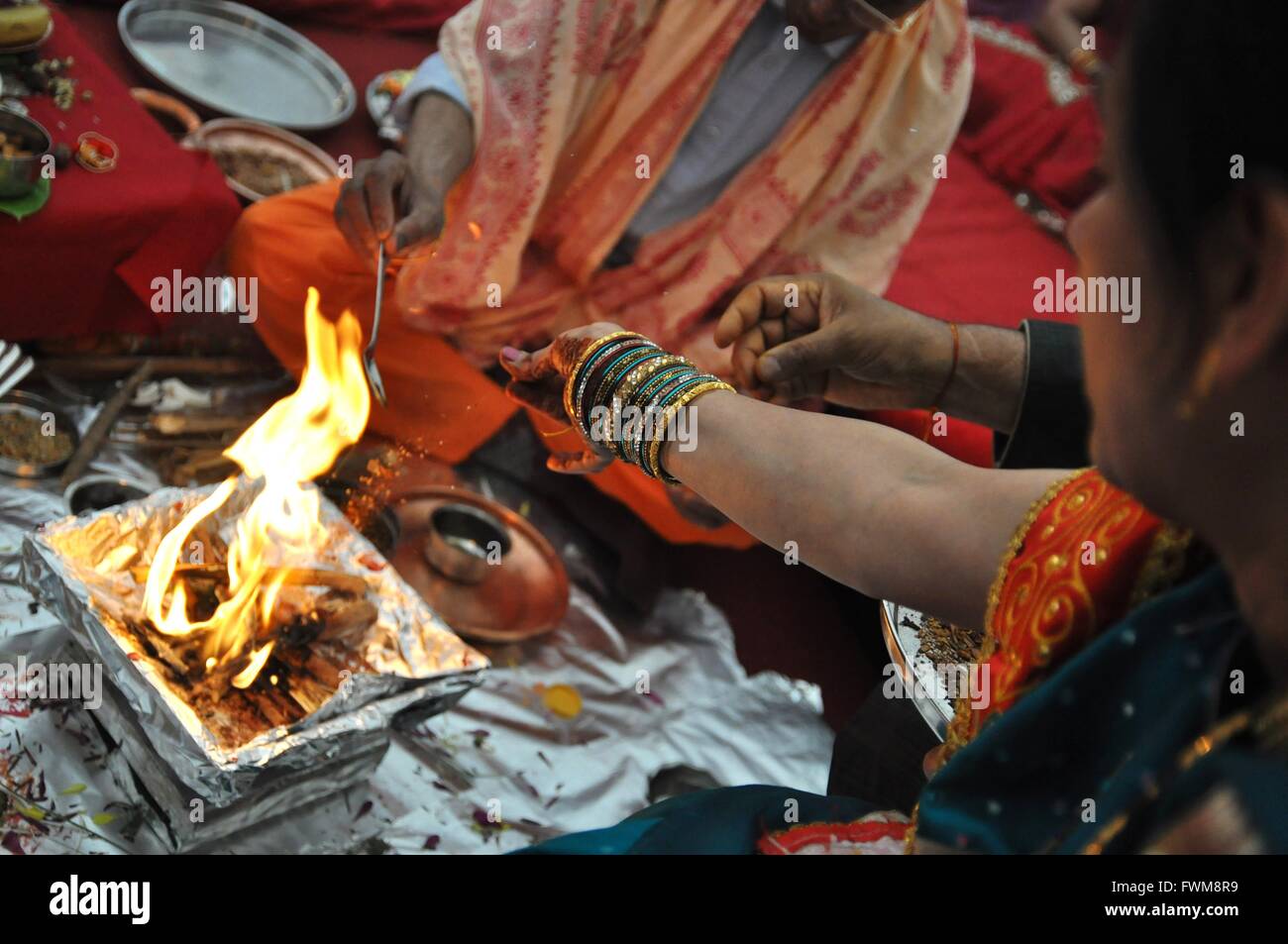 Indian bride performing traditional ritual hi-res stock photography and ...