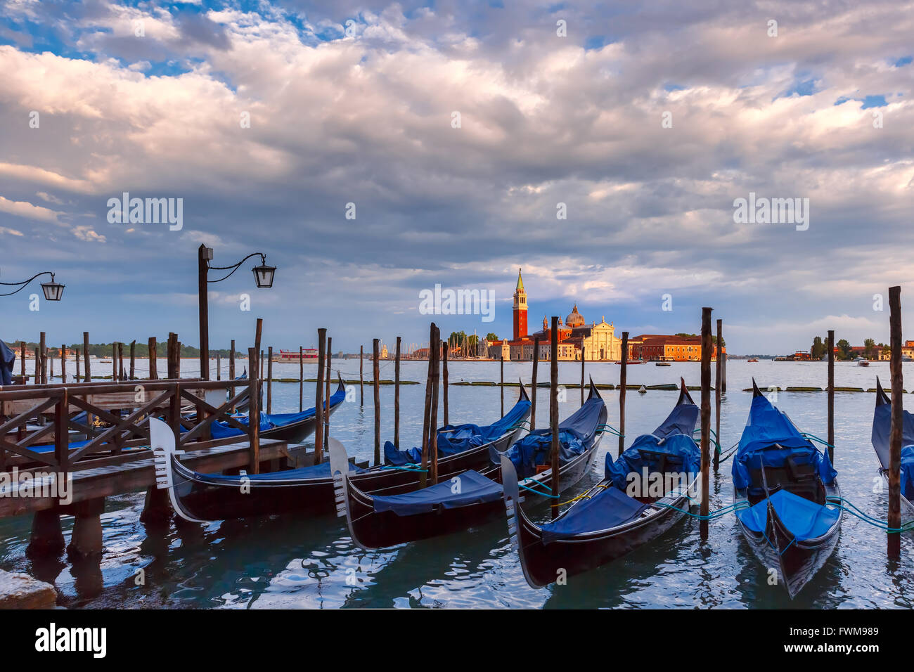 Gondolas at twilight in Venice lagoon, Italia Stock Photo - Alamy