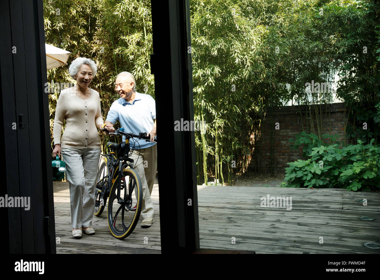 Senior couple in yard Stock Photo