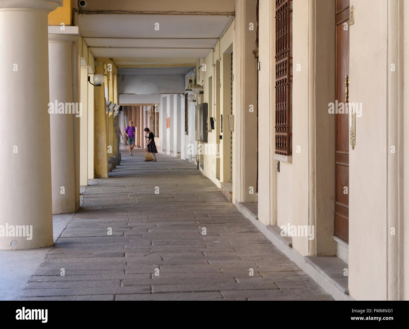 outdoor corridor with stone columns in Brescello, Reggio Emilia Province, Emilia Romagna, Italy Stock Photo