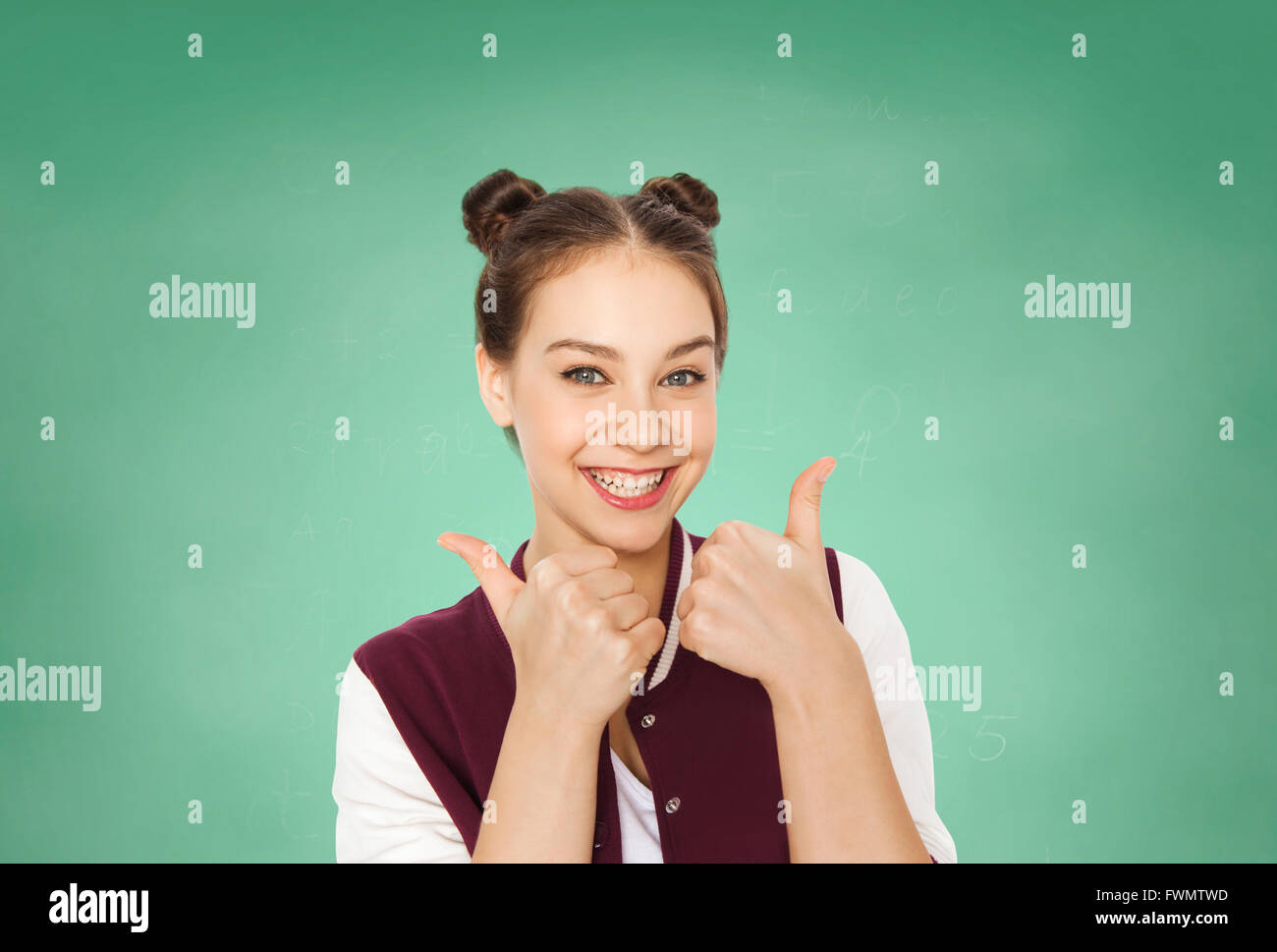 happy teenage student girl showing thumbs up Stock Photo - Alamy