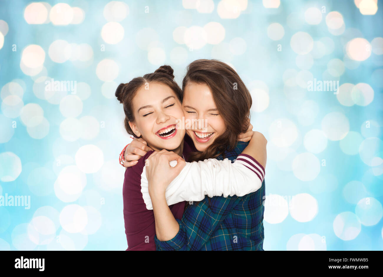 happy smiling pretty teenage girls hugging Stock Photo - Alamy