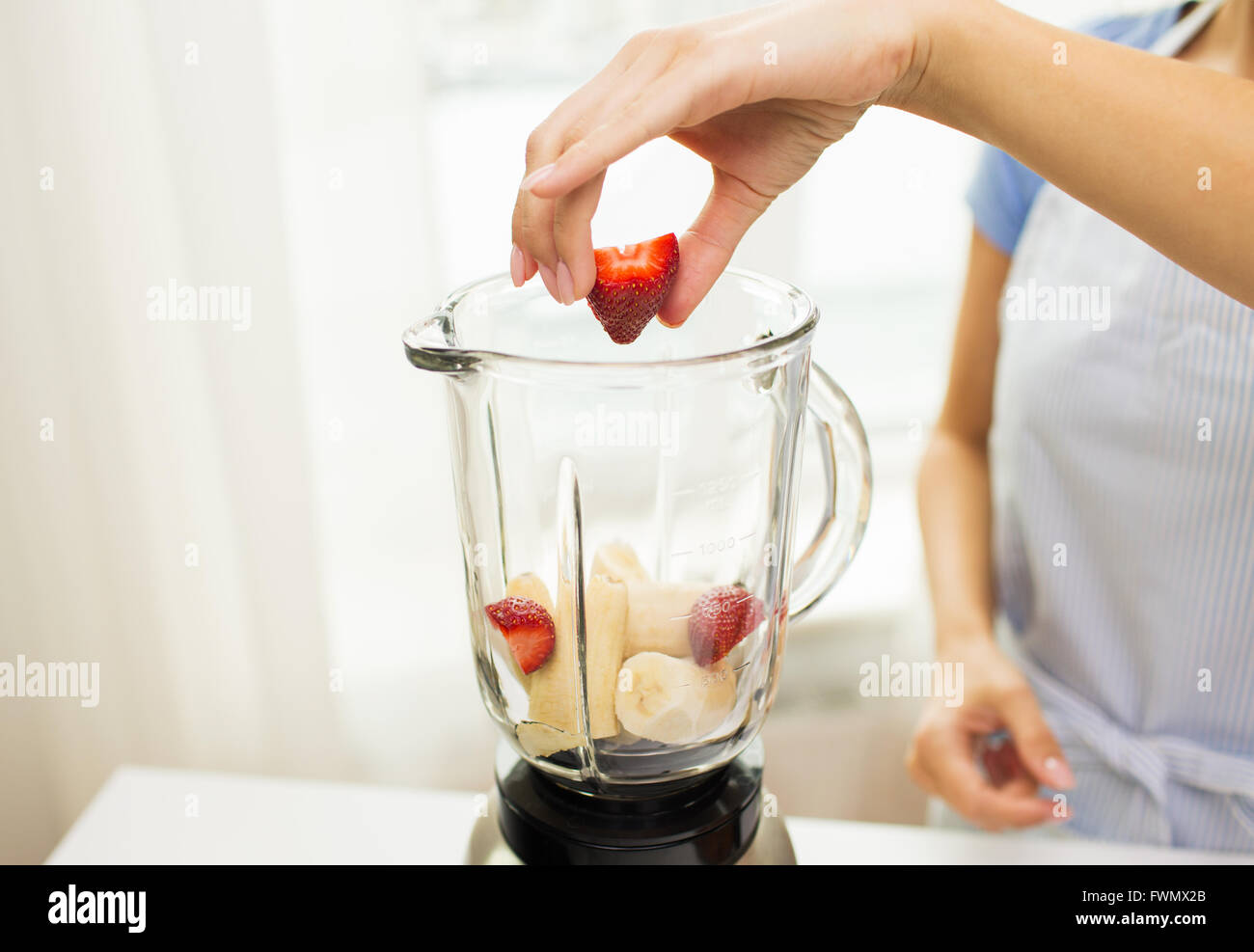 close up of woman with blender making fruit shake Stock Photo Alamy