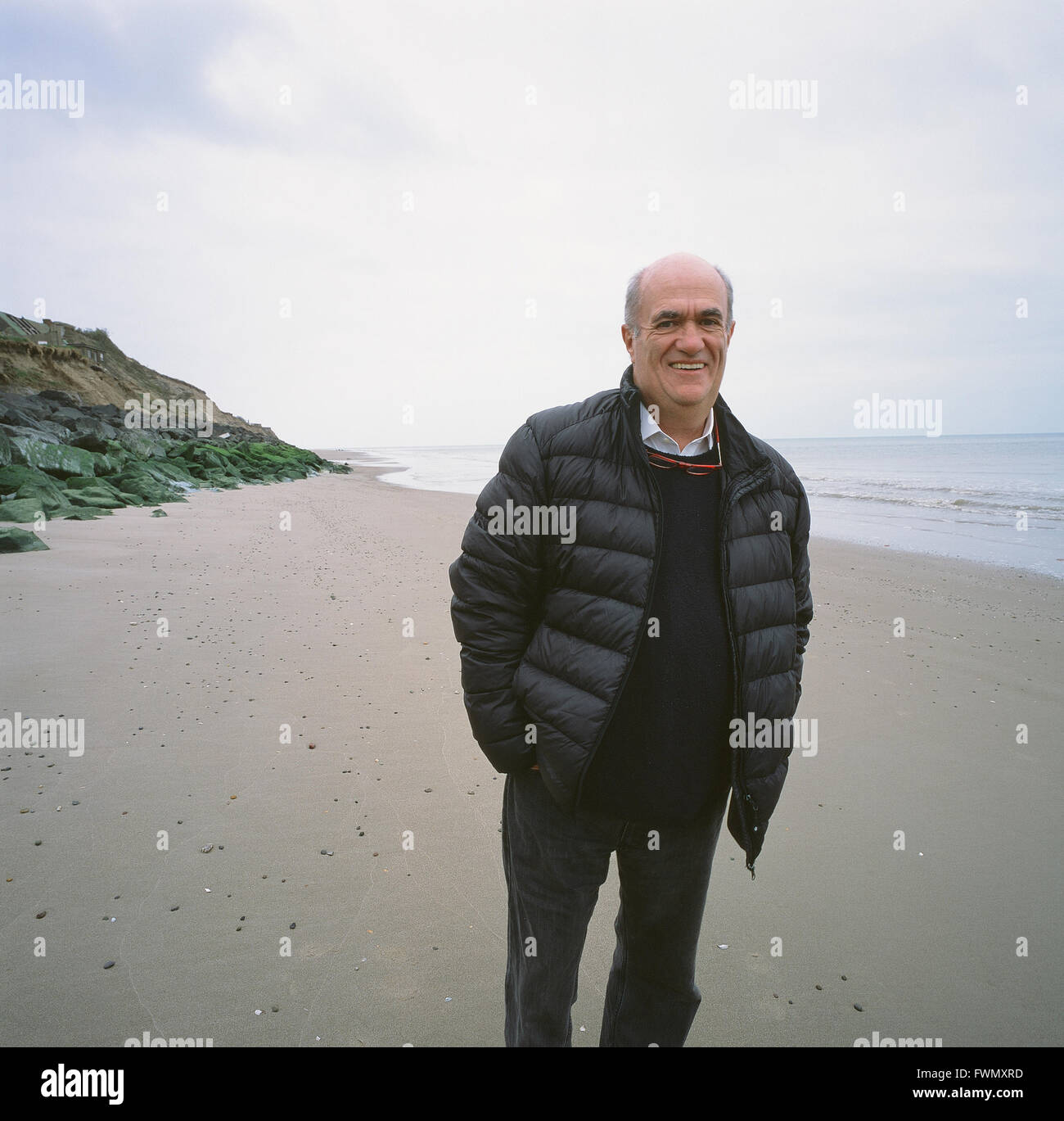 Irish author, Colm Toibin, at Ballyconnigar Strand, near Enniscorthy, County Wexford. The Strand features in several of his novels. Stock Photo