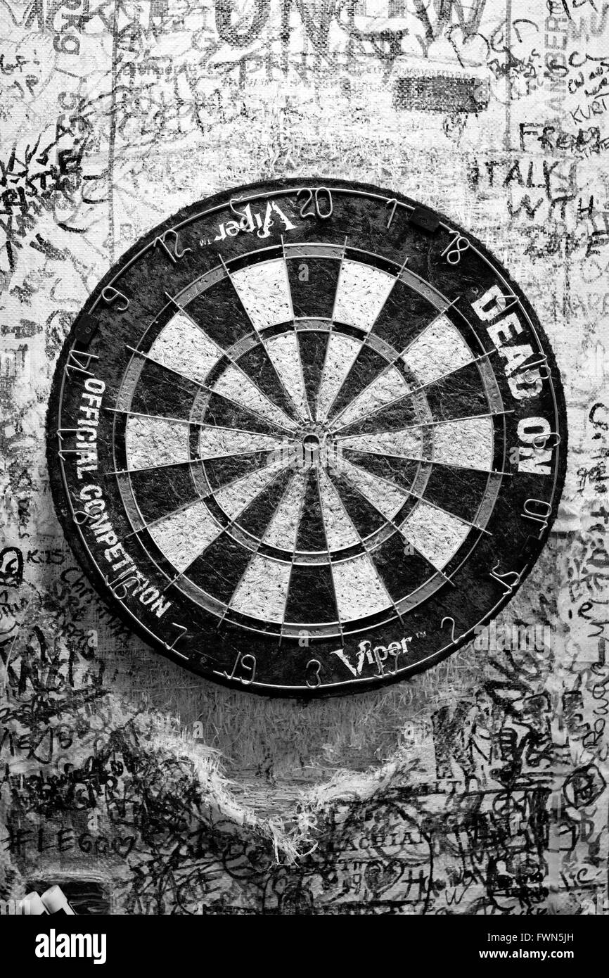 Fullstream Brewery & Tavern, Durham, North Carolina NC USA. Southern craft beer and food.  An old very used dart board in BW Stock Photo