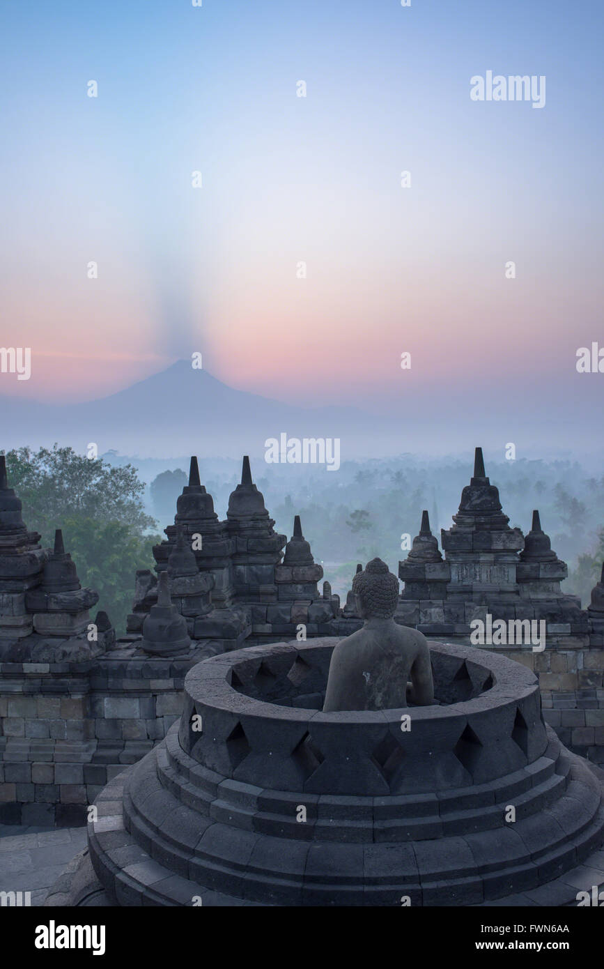 Sunrise over the Merapi volcano at Borobudur Temple Stock Photo