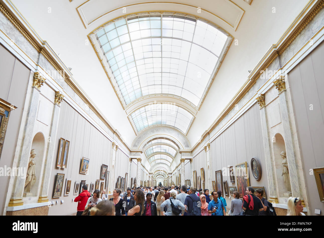 Paris, the Louvre Museum, Denon wing where are exposed the Italian paintings with visitors Stock Photo