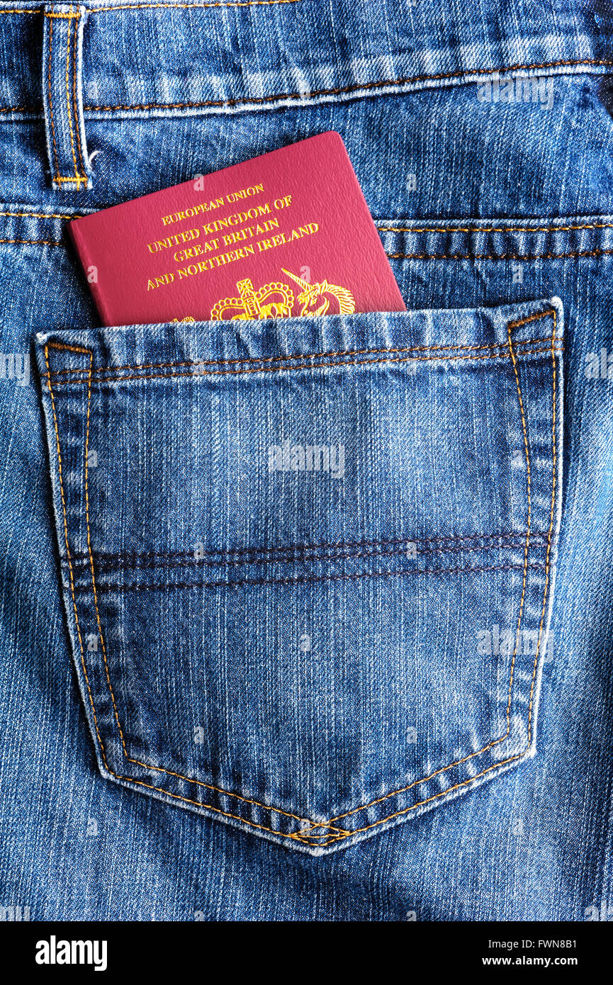 Jeans back pocket with UK passport poking out. Stock Photo