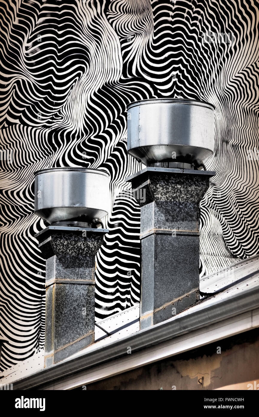 Roof Chimneys set against Optical Street Art Mural Stock Photo