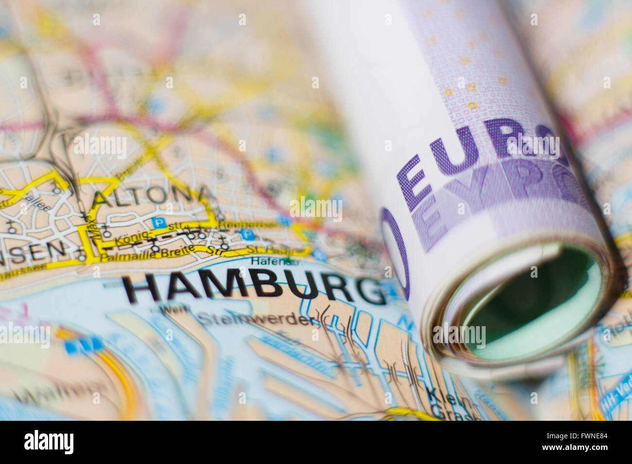Euro banknotes on a geographical map of Hamburg, Germany Stock Photo