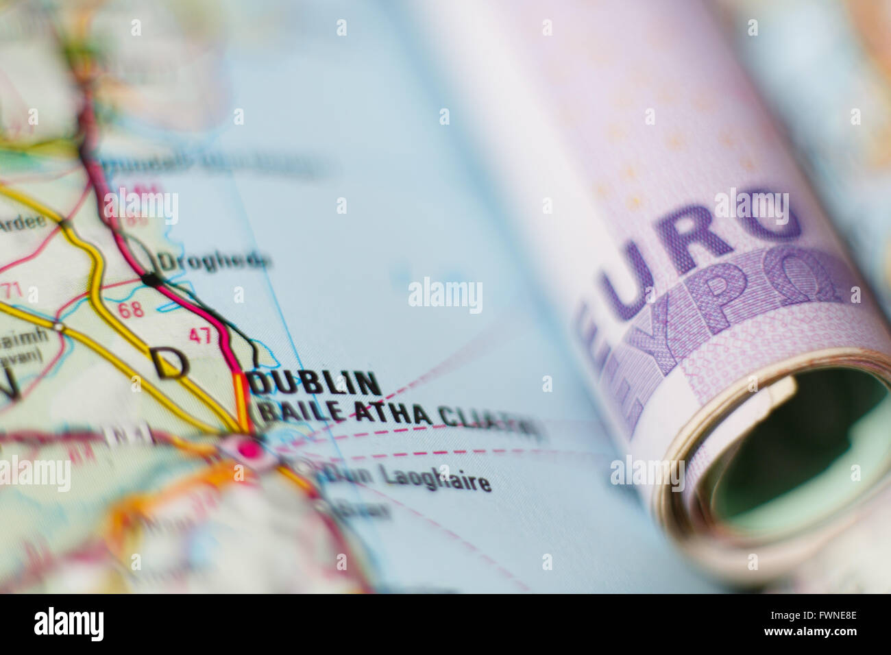 Euro banknotes on a geographical map of Dublin, Ireland Stock Photo