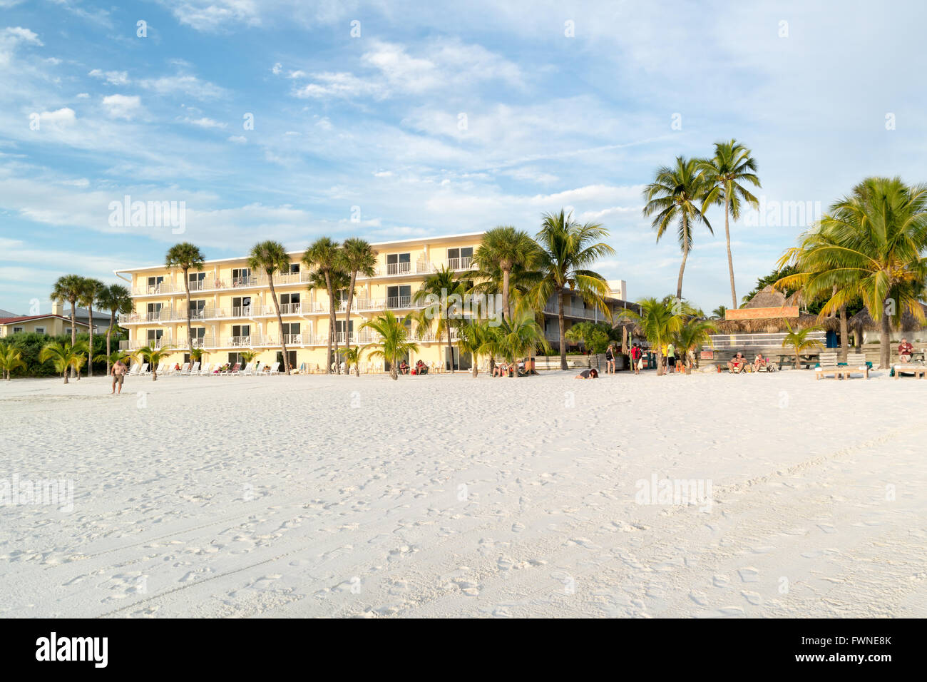 Hotel and people on beach of Fort Myers Beach on Estero Island at west coast of Florida, USA Stock Photo