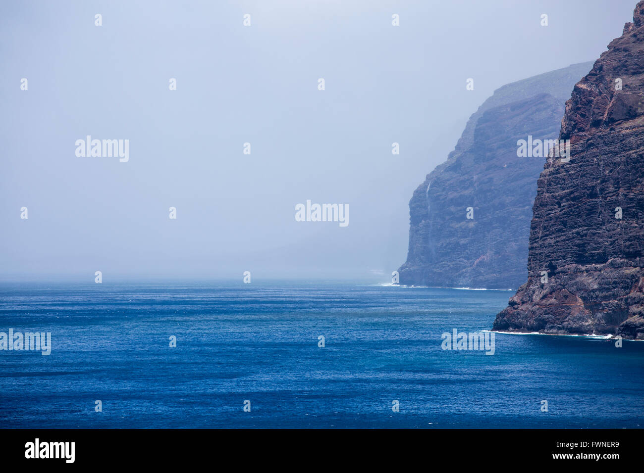 A Wet and windy weather at the cliffs of Los Gigantes, normally a sunny holiday resort in Tenerife, Canary Islands, Spain. Stock Photo