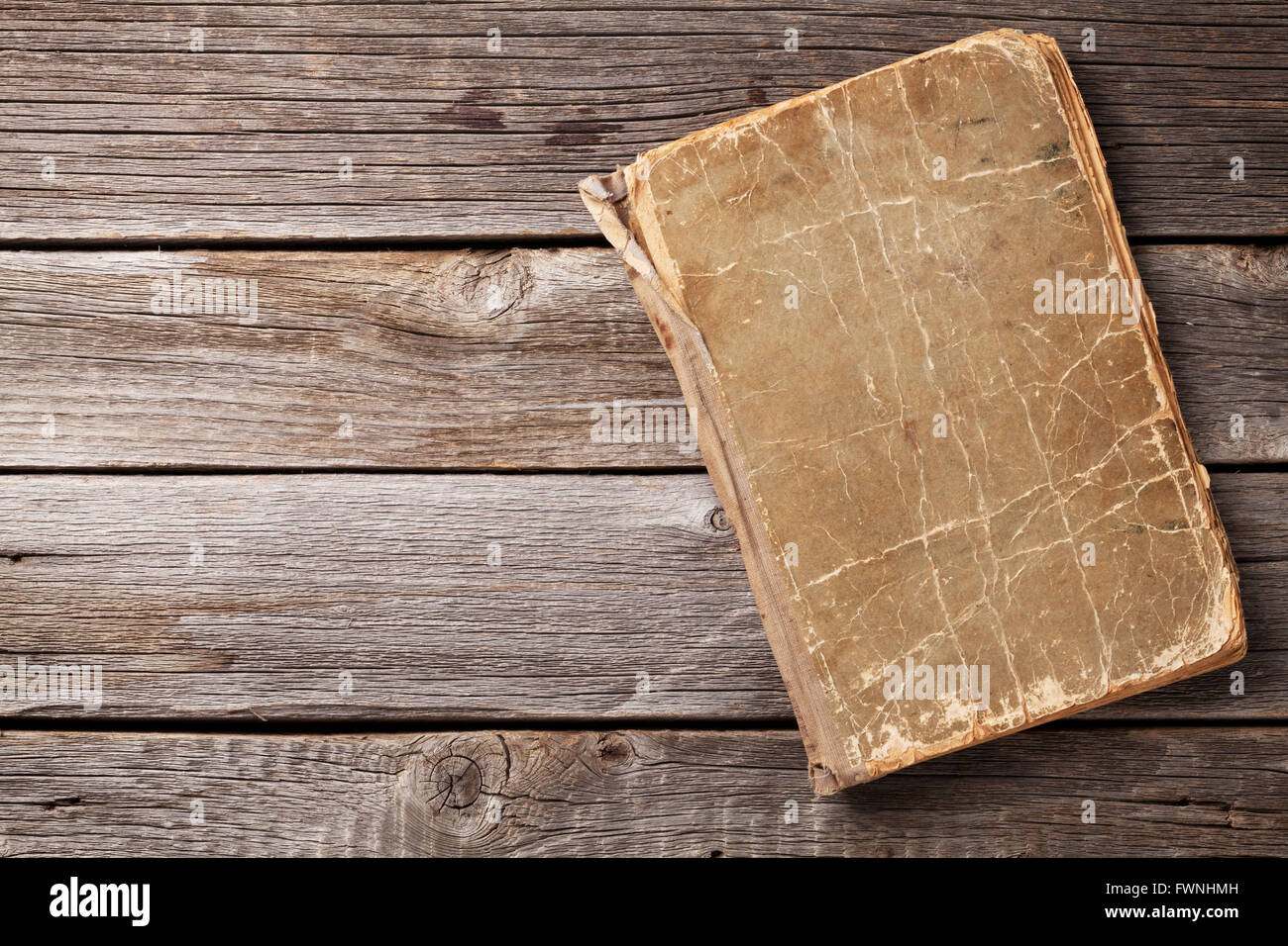 Vintage book on wooden background. Top view with copy space Stock Photo