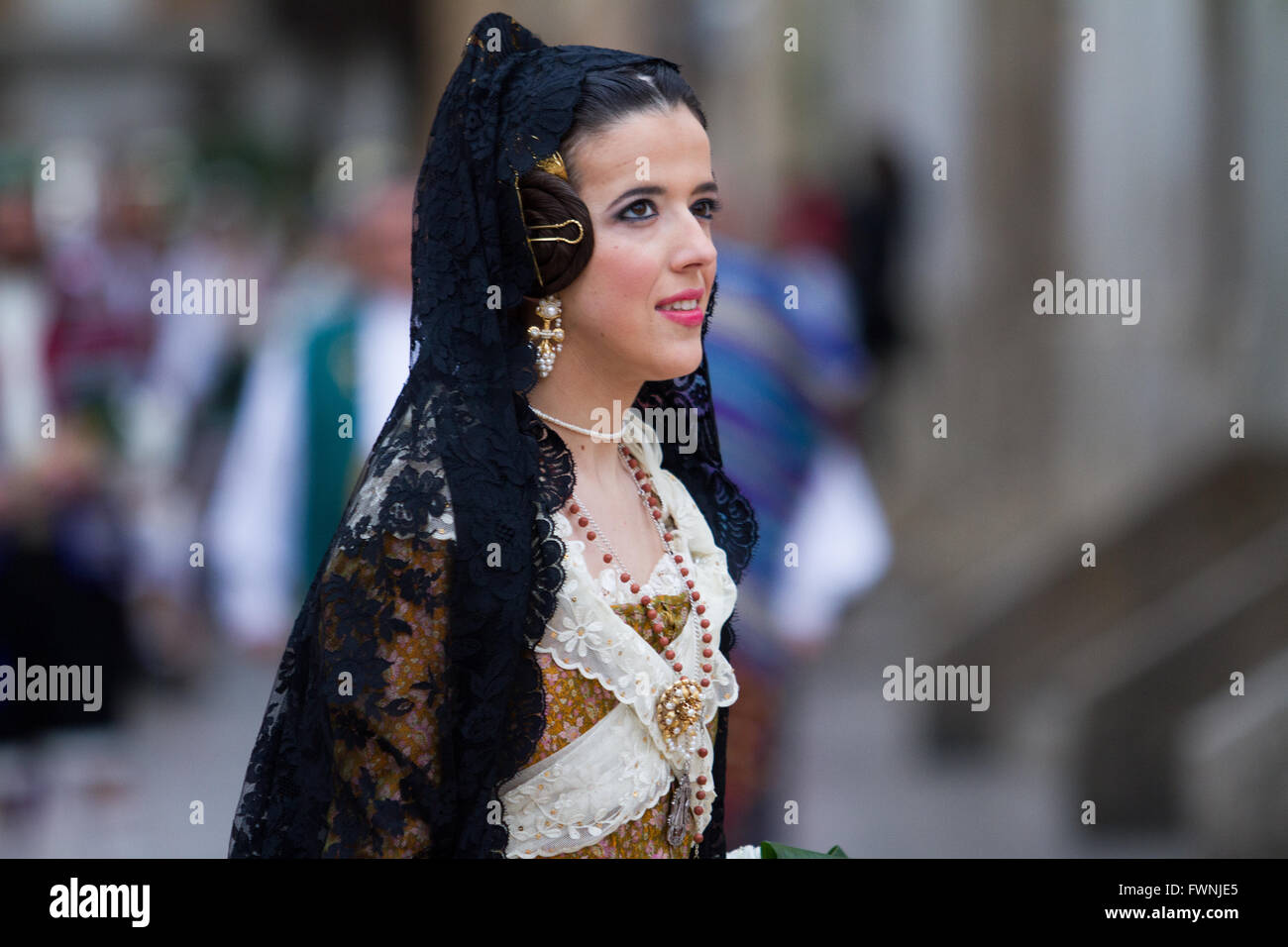 Woman dressed in traditional costume at the annual procession for  the offerings to the Lady of the Forsaken Valencia Spain Stock Photo