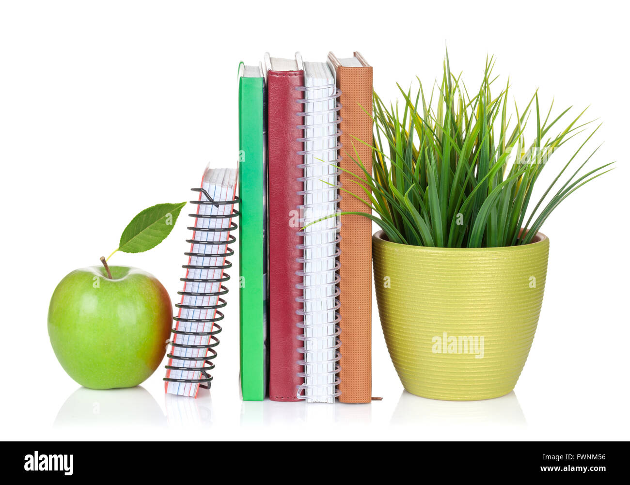 School and office supplies. Notepads, flower and apple. Isolated on white background Stock Photo