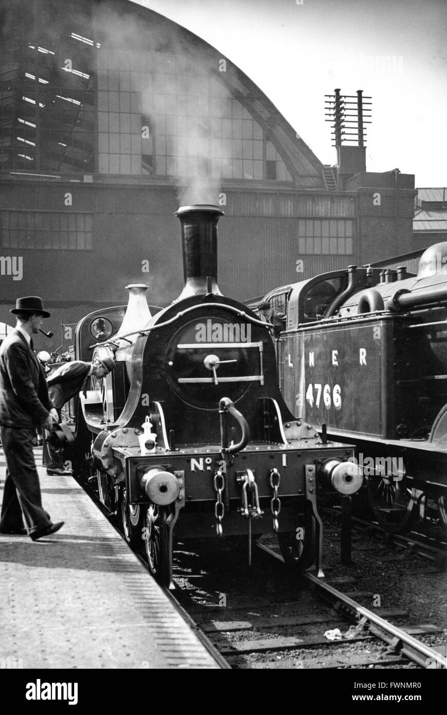 Prior to the 1938 acceleration of the Flying Scotsman a replica of the 1888 twin of seven 6 wheeled coaches Stock Photo