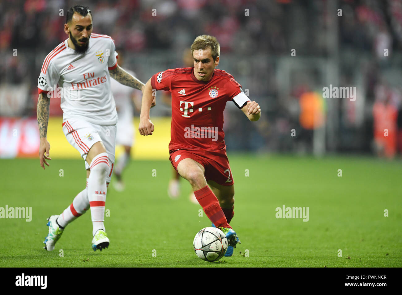 Munich, Germany. 5th Apr, 2016. Munich's Philipp Lahm (r) and Benfica's Kostas Mitroglou in action during the Champions League quarter finals first leg match between Bayern Munich and S.L. Benfica at Allianz Arena in Munich, Germany, 5 April 2016. PHOTO: ANDREAS GEBERT/dpa/Alamy Live News Stock Photo