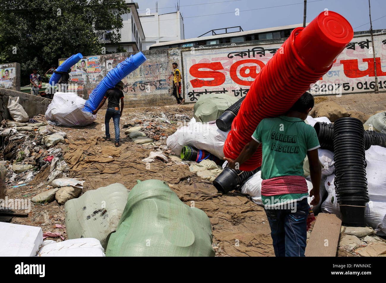 April 6, 2016 - Dhaka, Bangladesh - Workers are carrying plastic buckets. (Credit Image: © Mohammad Ponir Hossain via ZUMA Wire) Stock Photo