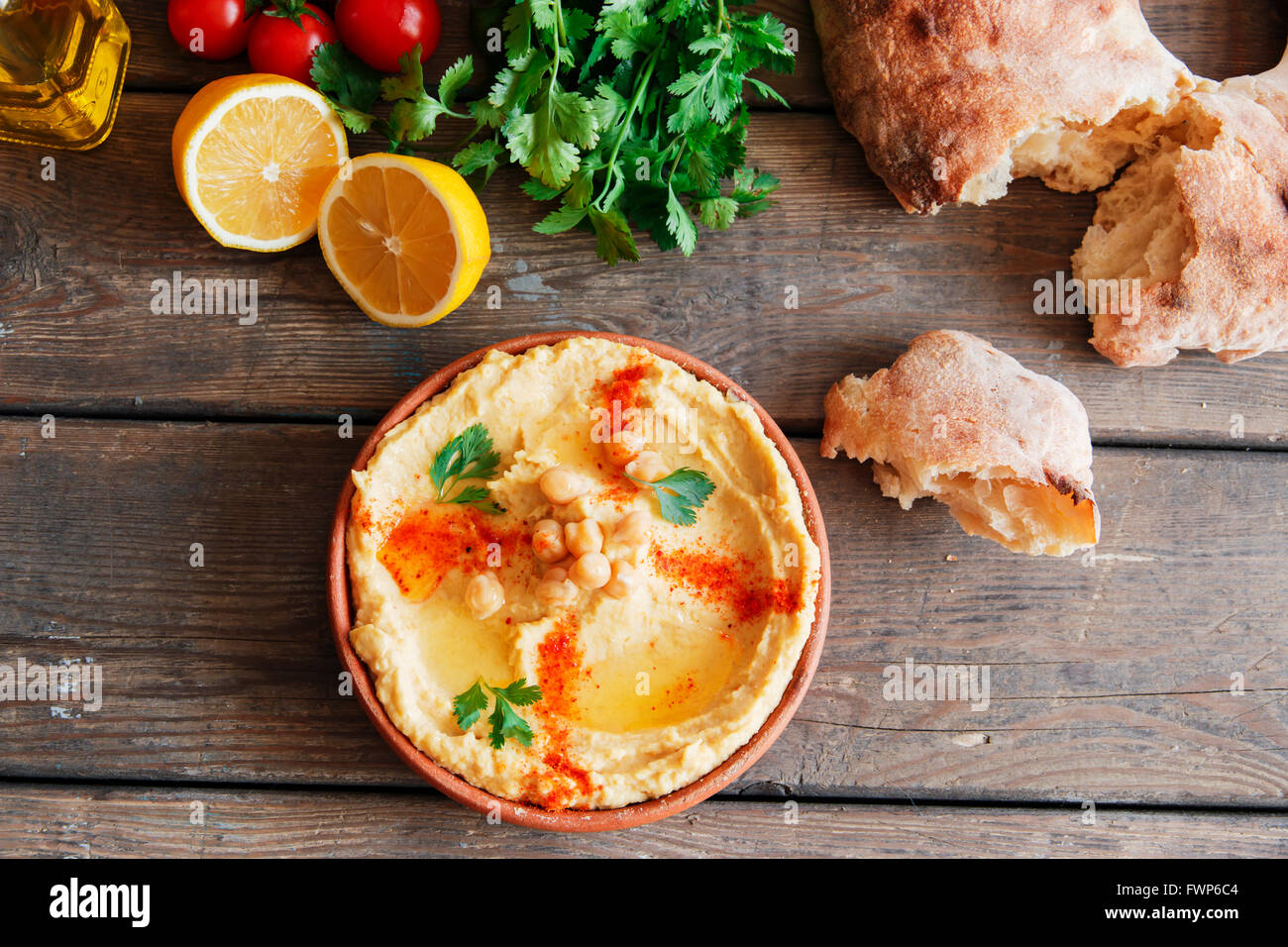 Healthy Homemade Creamy Hummus with Olive Oil and Pita Stock Photo
