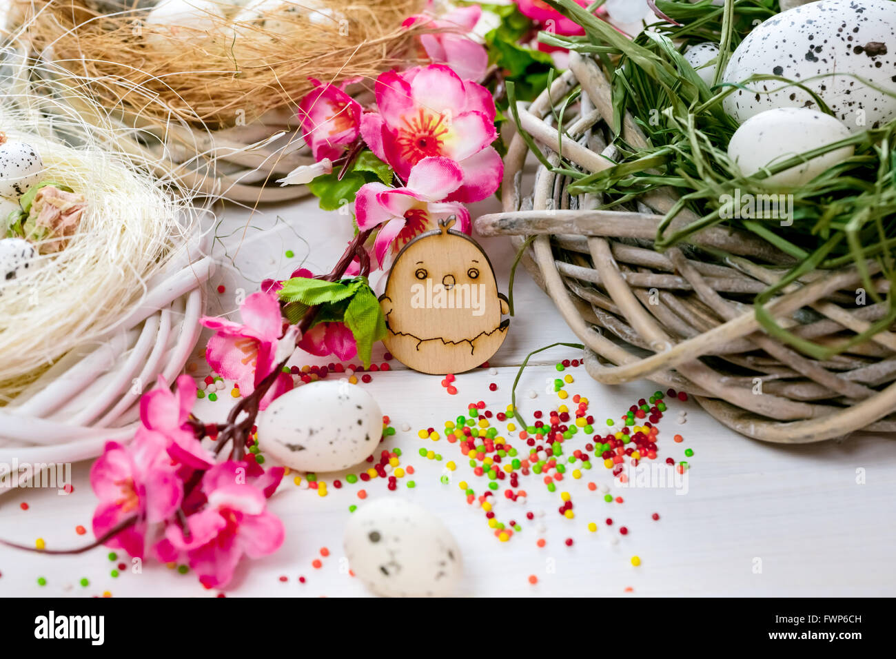 Beautiful Easter background with flowers and nest with eggs on white ...