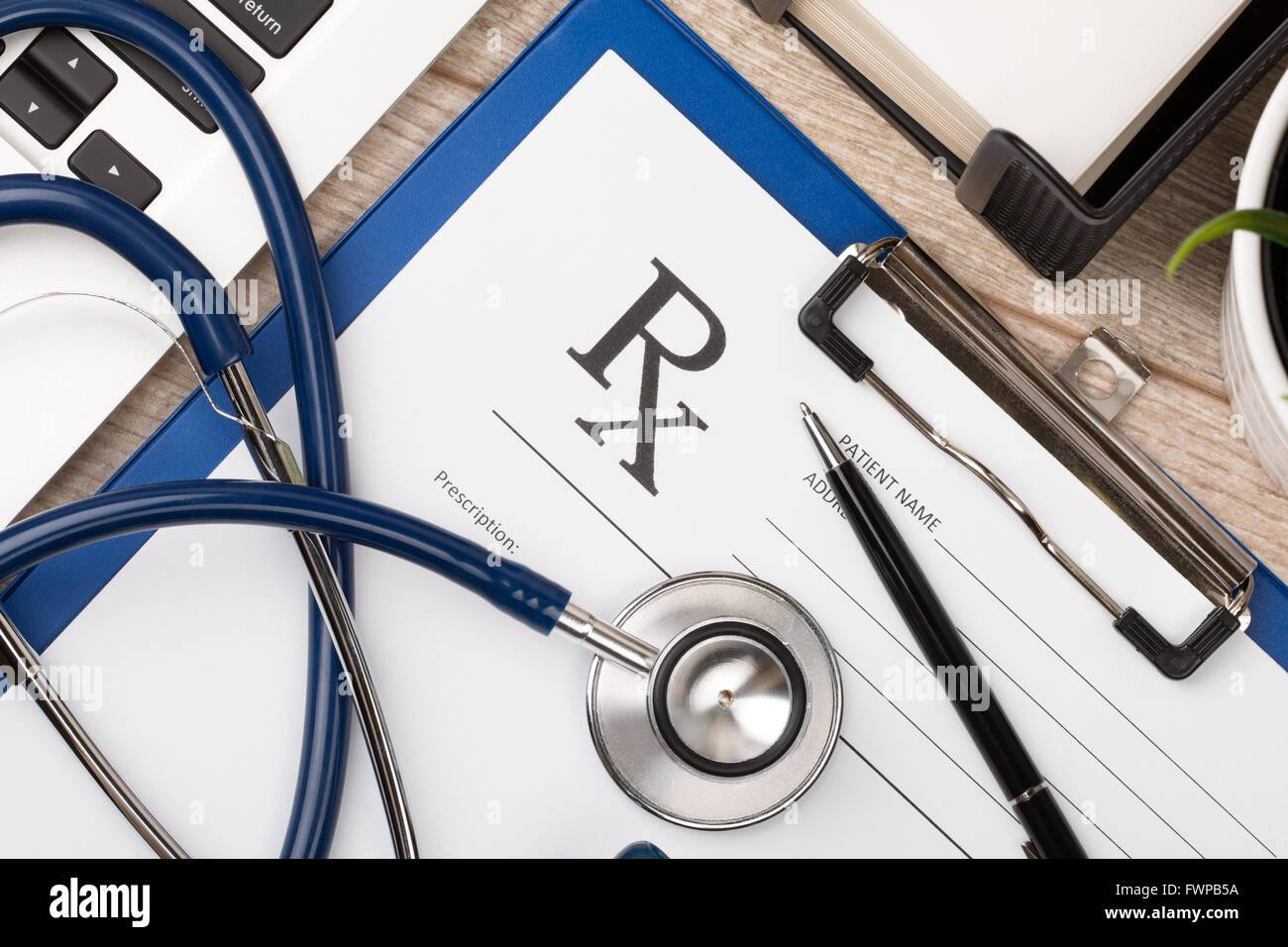 Closeup top view of pharmaceutical chemist working place. Stethoscope