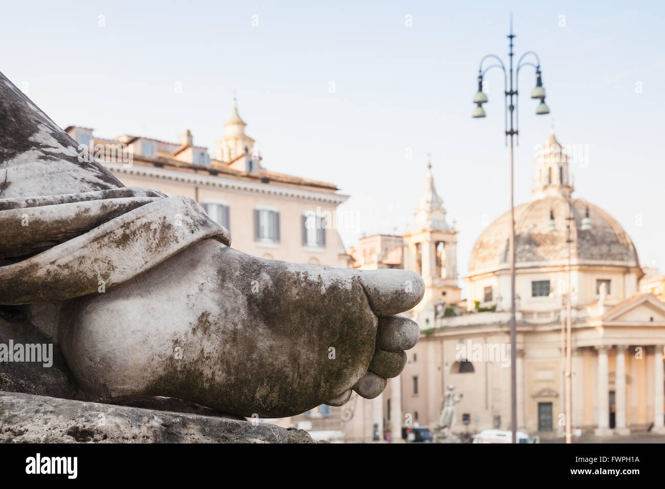 Dirty human leg, Fragment of ancient sculpture on the Piazza del Popolo square, old city center of Rome, Italy Stock Photo