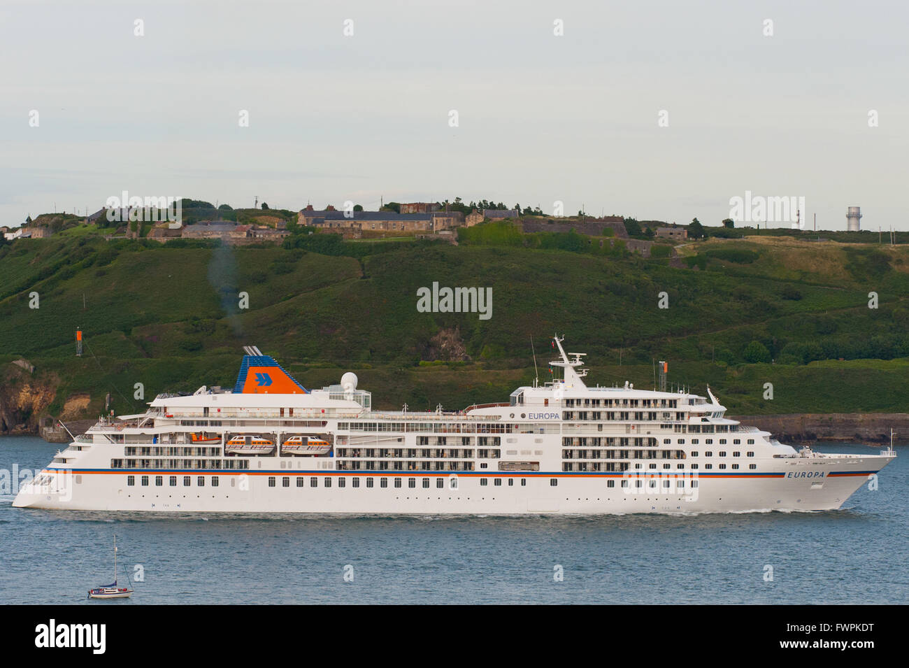 Cruise liner Europa passes Fort Davis (formerly Fort Carlisle) in Cork Harbour, Co. Cork, Ireland. Stock Photo