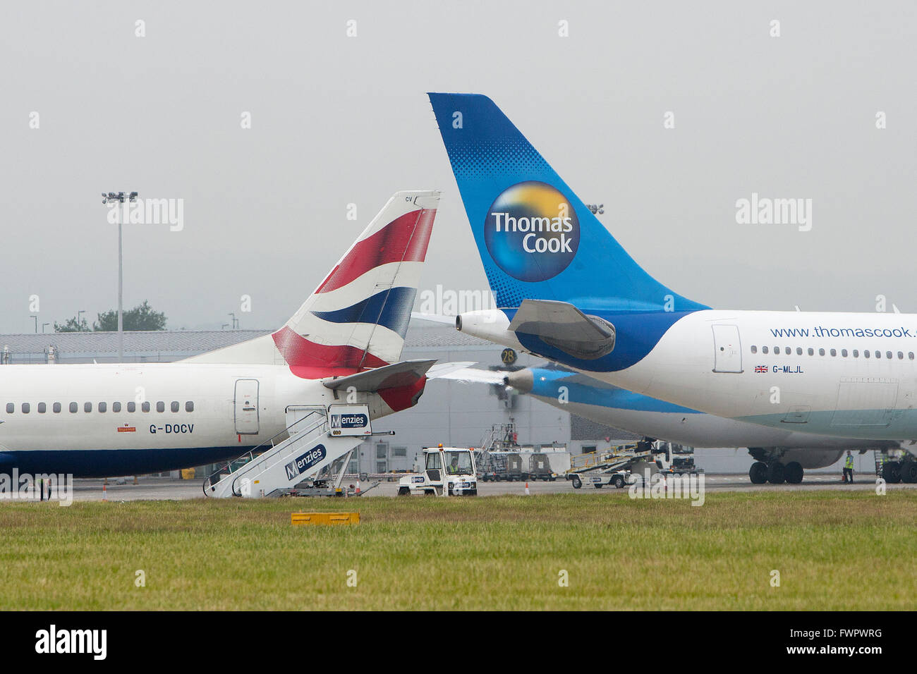 British Airways and Thomas Cook tail fins at Glasgow airport. Stock Photo