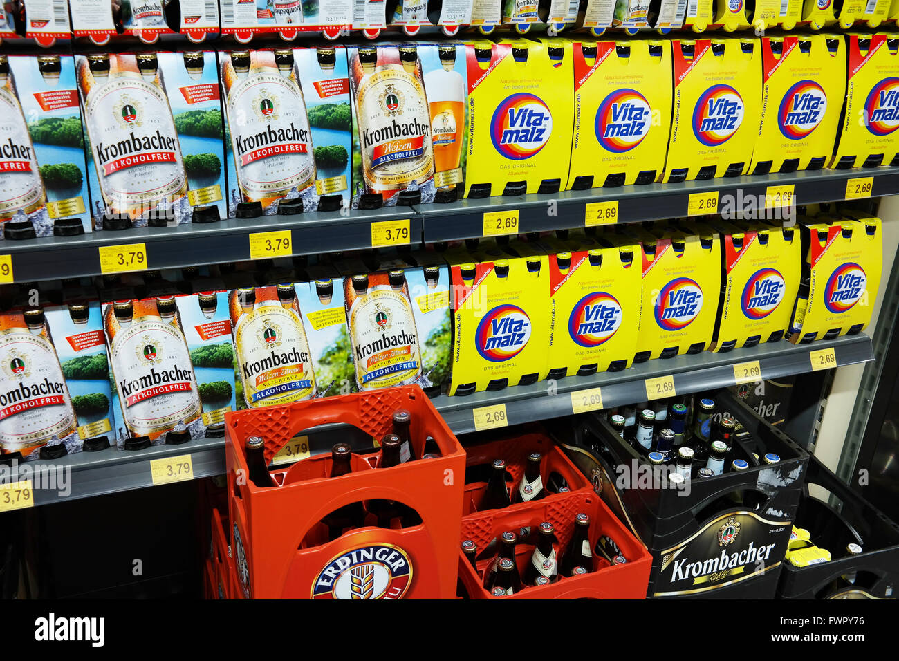 Shelves with various Alcohol free 6pack Beer packings in a Combi supermarket. Stock Photo