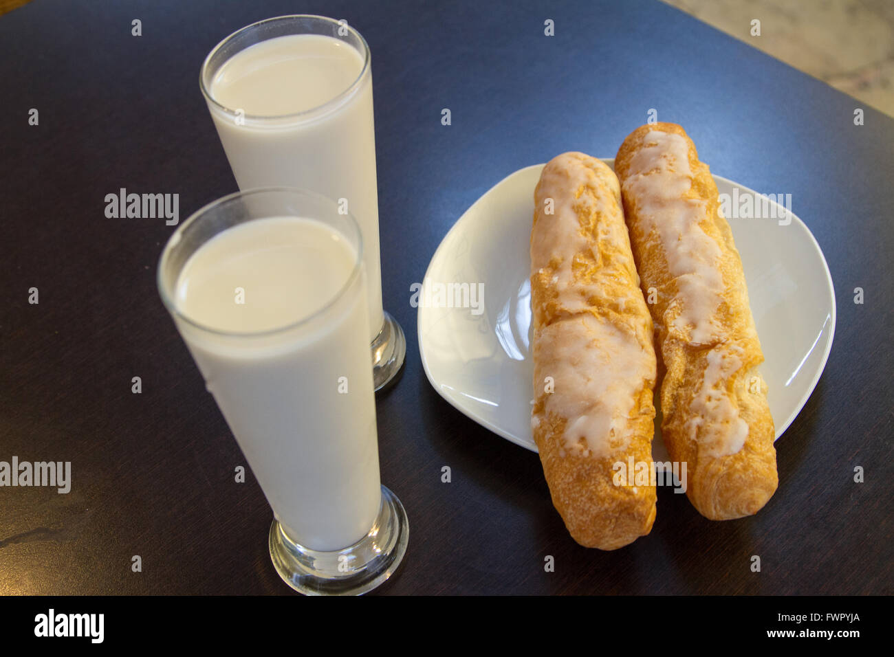 Horchata drink made from ground tiger nuts (chufa) with Farton sweet bread Specialty of Valencia Spain Stock Photo