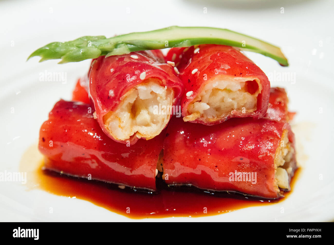Shrimp filled crispy red rice flour rolls served at Shang Palace ShangriLa Hotel Paris Stock