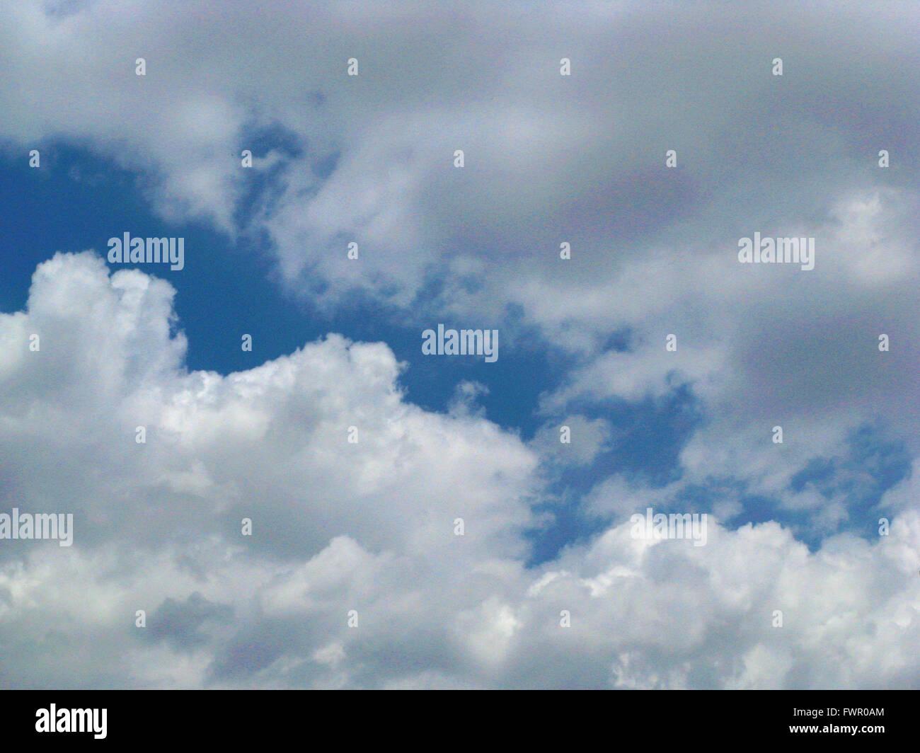 White clouds against blue sky Stock Photo - Alamy