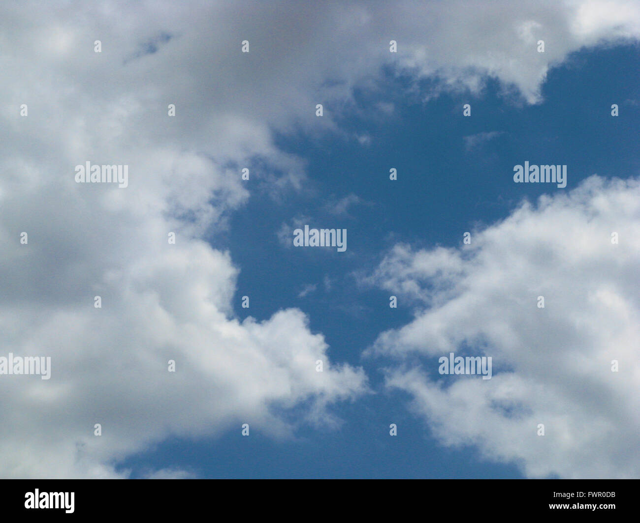 White clouds against blue sky Stock Photo - Alamy