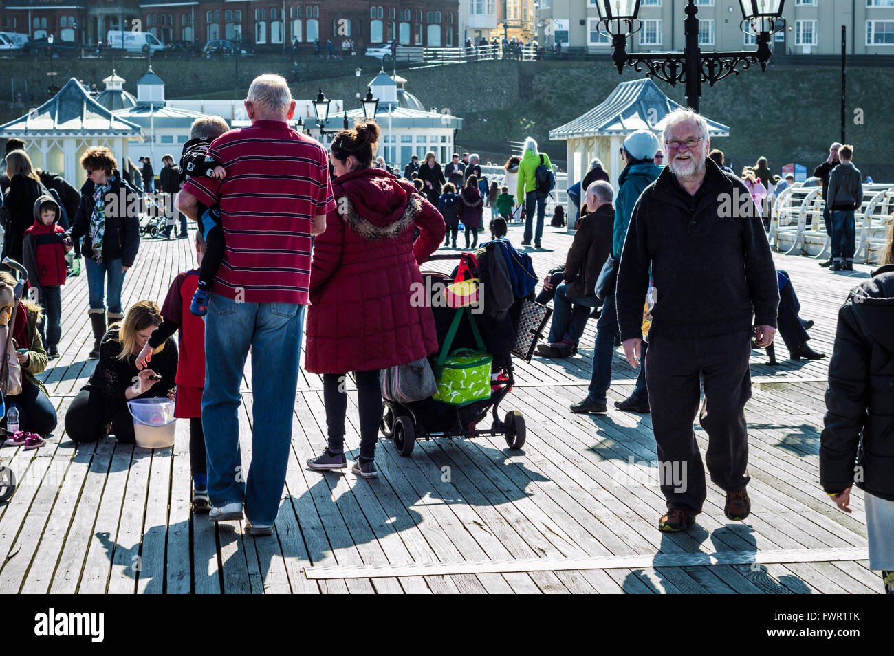 People on Cromer Pier, Norfolk, England enjoying day out Stock Photo