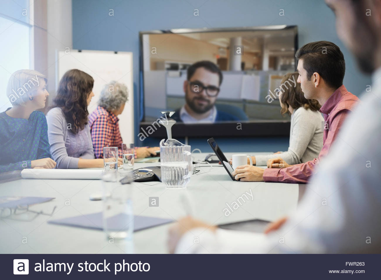 Business people participating in video conference Stock Photo - Alamy