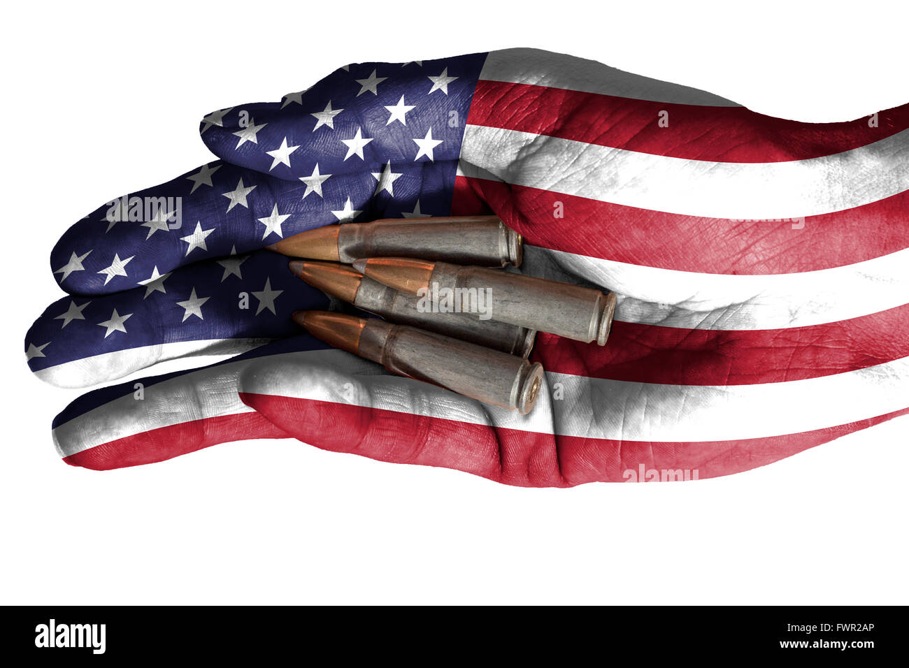 Flag of United States overlaid the hand of an adult man holding four bullets. Conceptual image for war, violence, conflicts. Ima Stock Photo