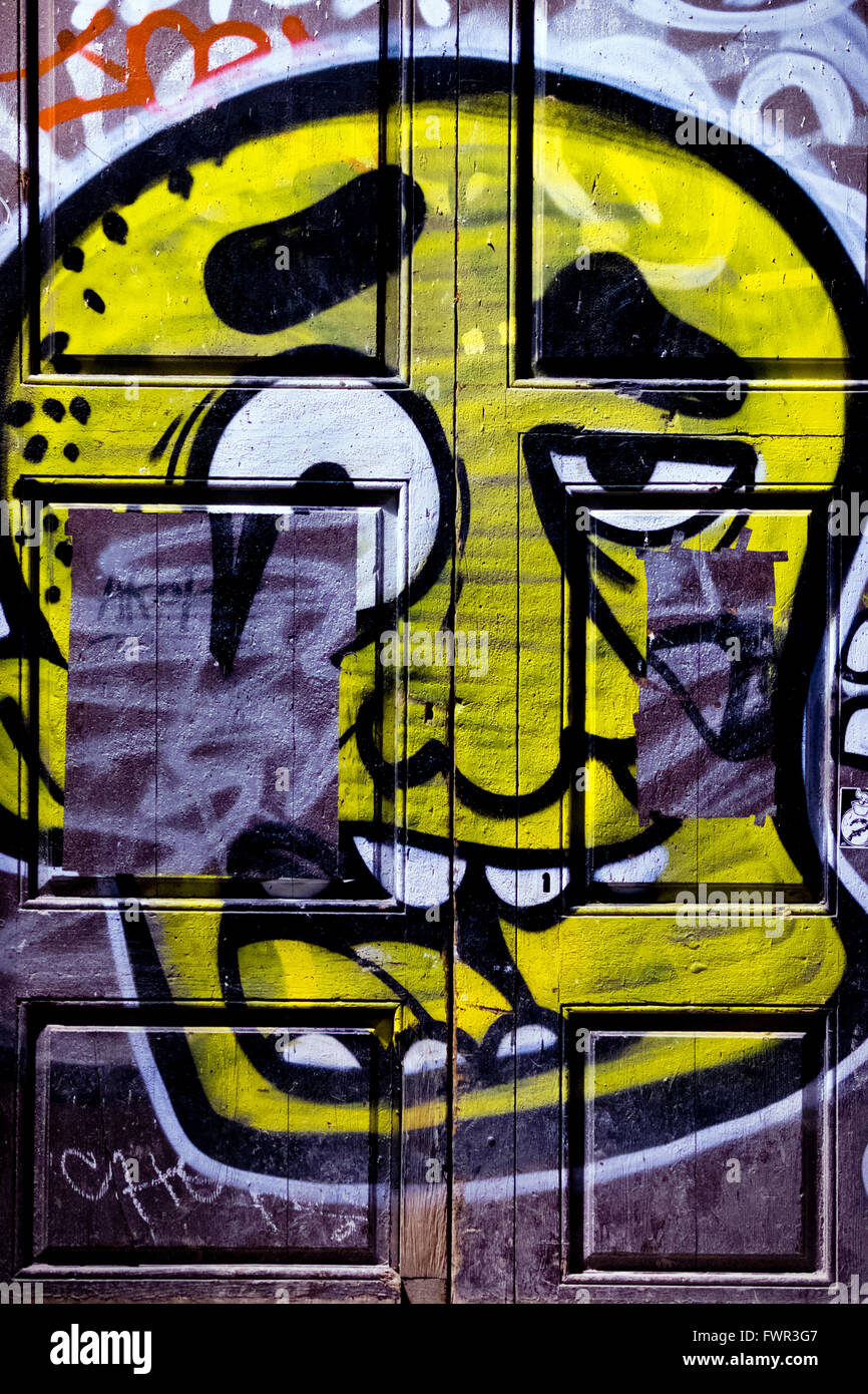 Art graffiti on door in Barri Gotic quarter, Barcelona, Spain Stock Photo
