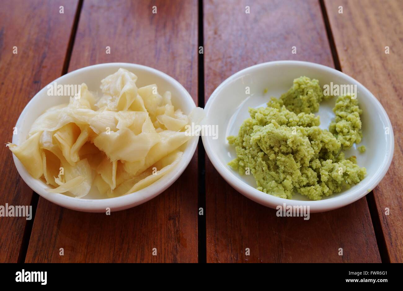 Dishes of green wasabi, pickled ginger and soy sauce Japanese